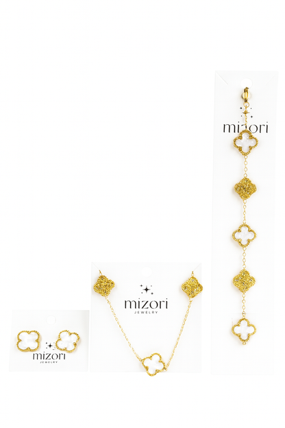 Mizori Jewelry stainless steel gold set with 13mm white clover necklace, bracelet, and earrings accented with sparkling stones, water resistant.