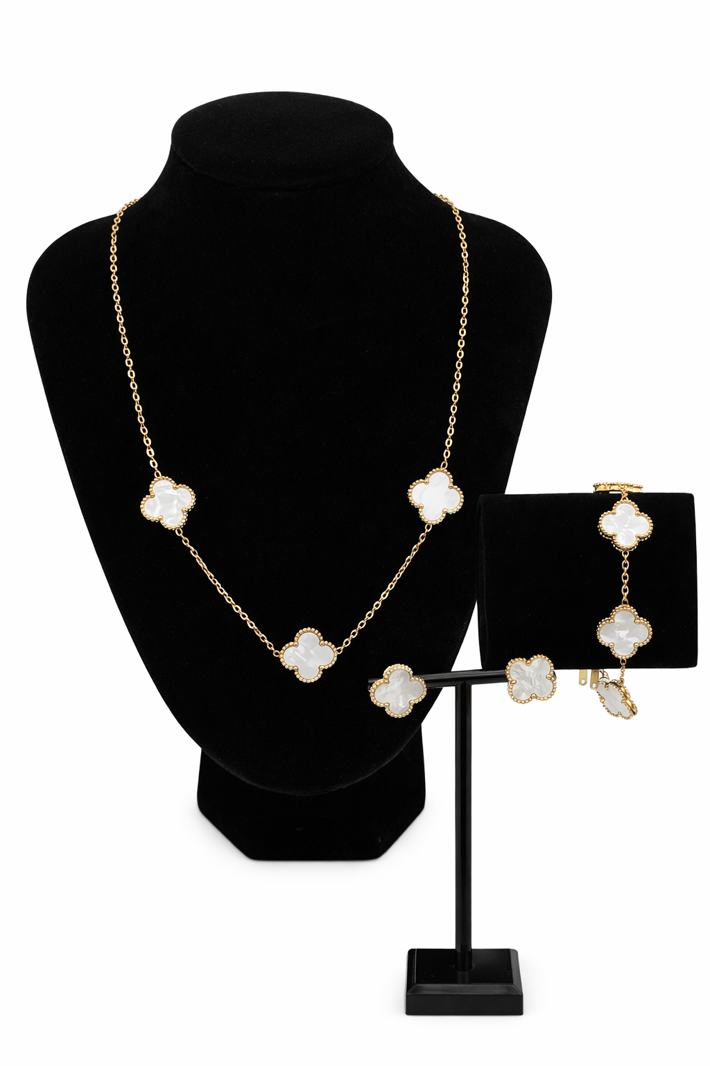 Mizori Jewelry stainless steel white and gold clover bracelet, earrings and necklace set on stand with white background