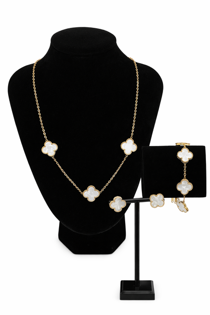 Mizori Jewelry stainless steel white and gold clover bracelet, earrings and necklace set on stand with white background